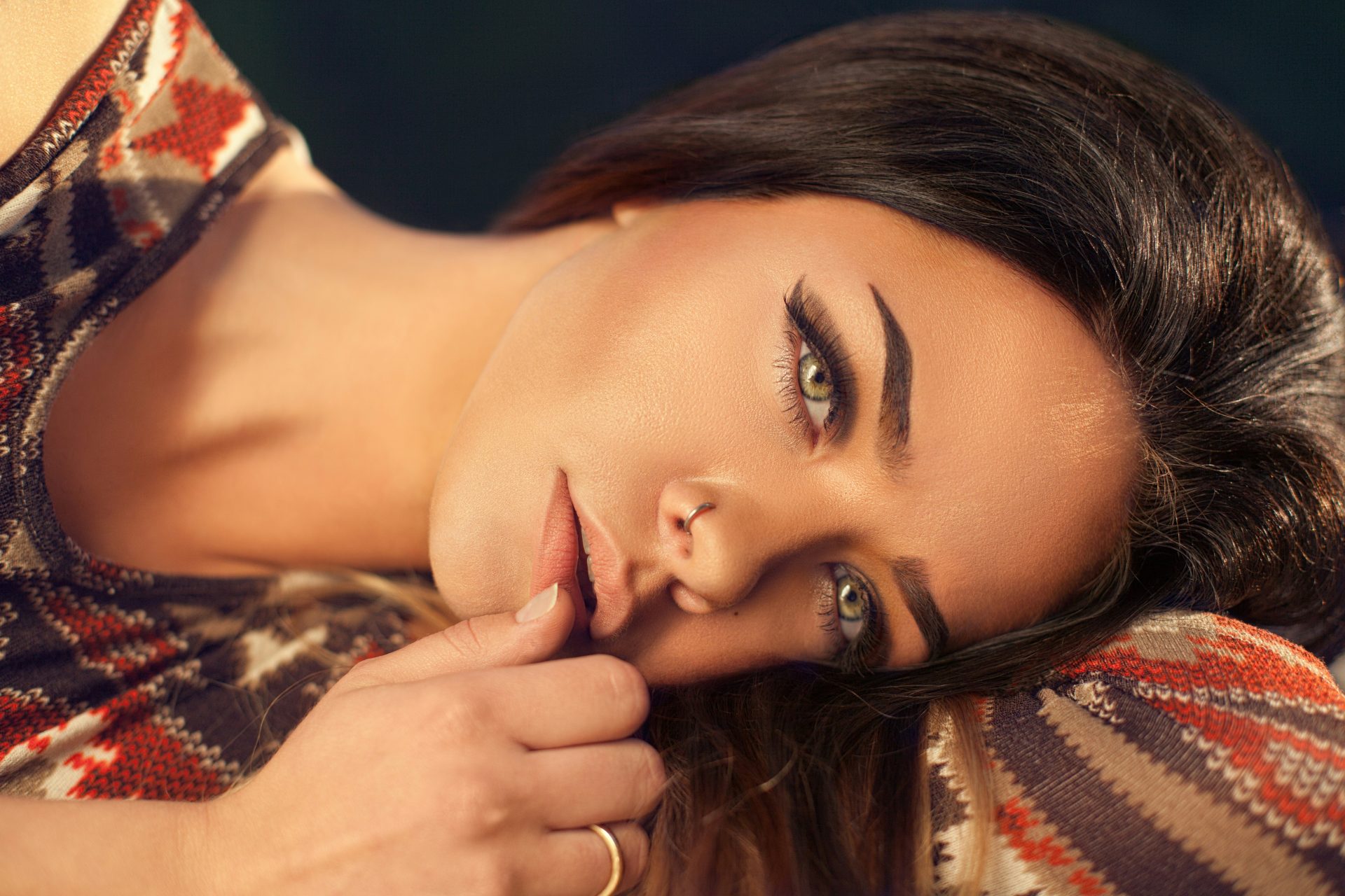 Woman resting with thoughtful expression